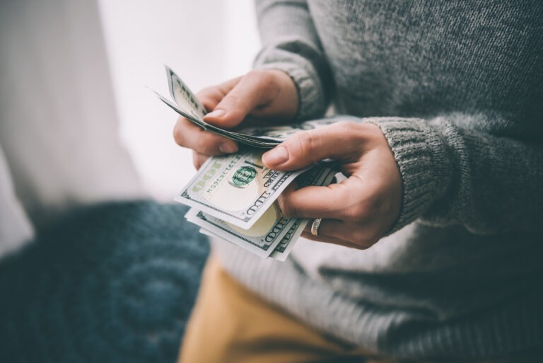 A women counter on her money left